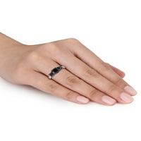 Zaručnički prsten od tri kamena od bijelog zlata od 14 karata s crno-bijelim dijamantom.